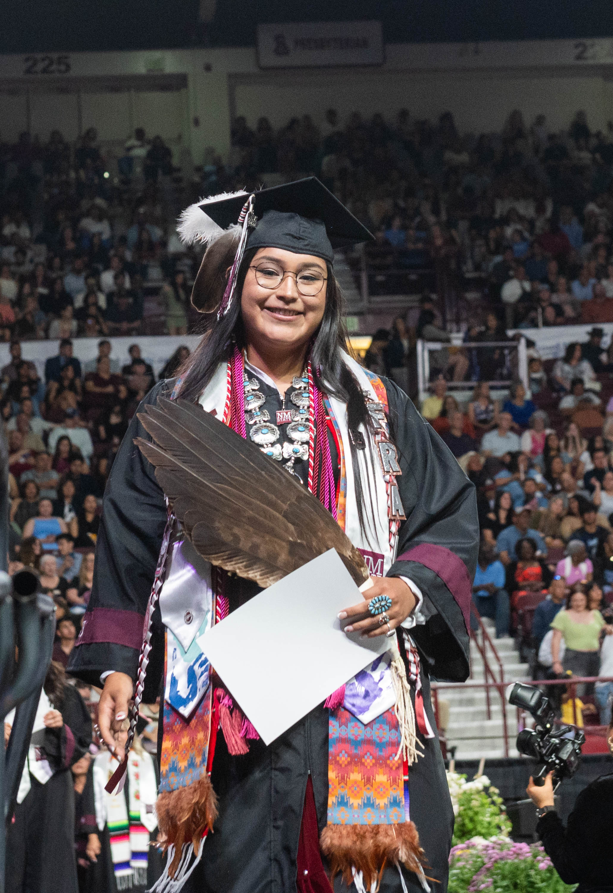 Graduate posing on platform